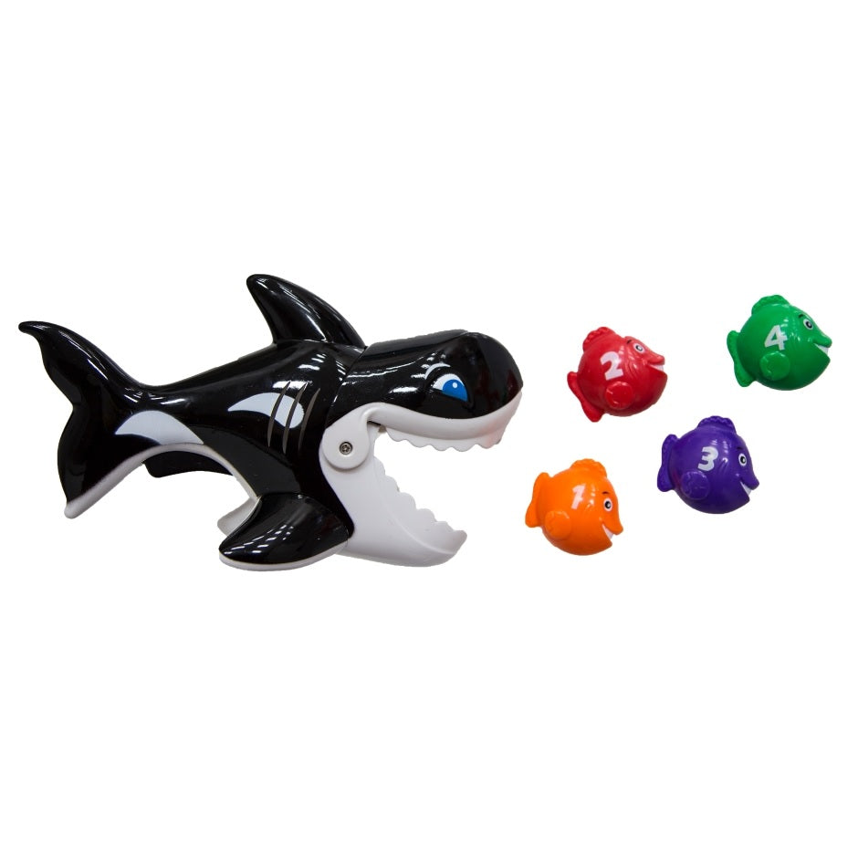 Pool game shaped like a whale whose mouth opens up. Kids try to use the whale's mouth to swallow up the little toy fish.