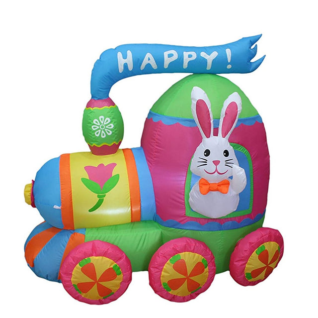 An inflatable train yard decoration. It's light blue, pink, lime green, white, orange and yellow. It features a bunny hanging out the window and it reads "HAPPY!"