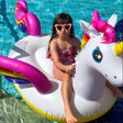 Inflatable pool float shaped like a rainbow unicorn.