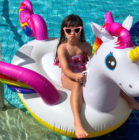 Inflatable pool float shaped like a rainbow unicorn.