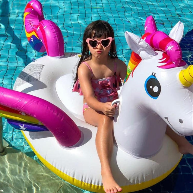 Inflatable pool float shaped like a rainbow unicorn.