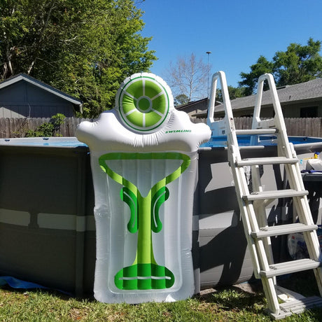 Pool float lounger shaped like a martini glass with a lime on top.