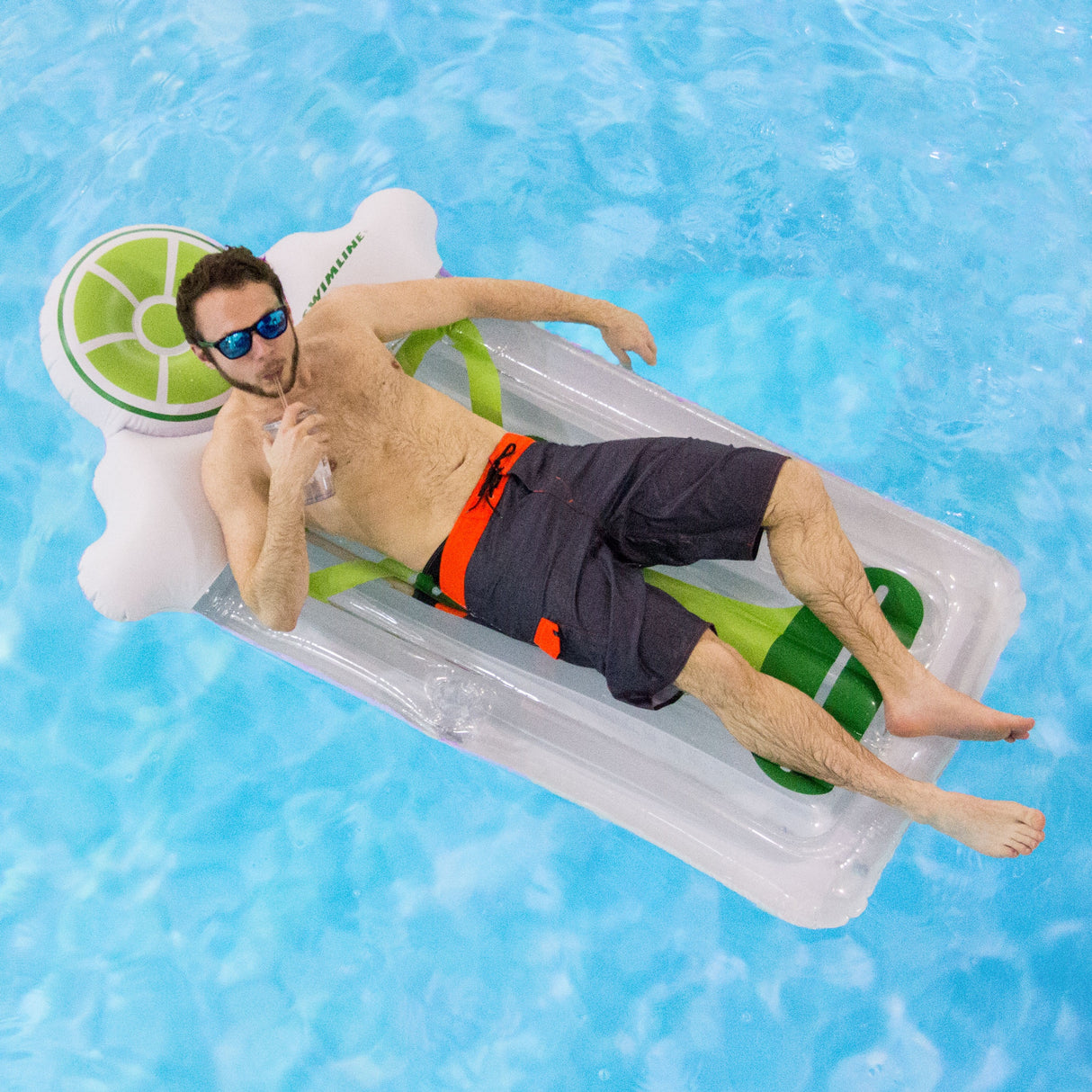 Pool float lounger shaped like a martini glass with a lime on top.