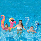 Pool inflatables shaped like seahorses. One is pink and one is blue.