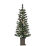 2 potted artificial trees. The tree tips are white to look like snow. The lights are warm white and there are red berry accents.