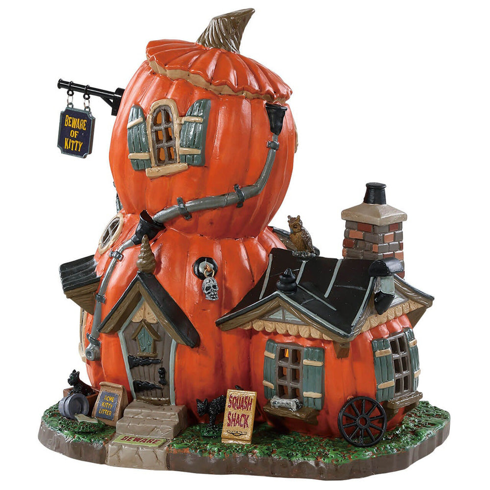 Porcelain building for a Lemax display. Designed to look like a shack made out of pumpkins.