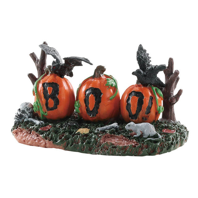 Polyresin figure for a Lemax display. Designed to look like carved pumpkins on a grassy patch. There are bones, rats, crows and bare trees. The pumpkins are carved to read BOO!