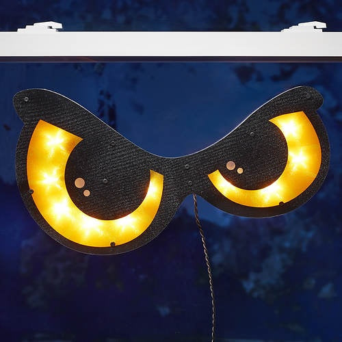 Decoration that is shaped like spooky, orange eyes. They light up.