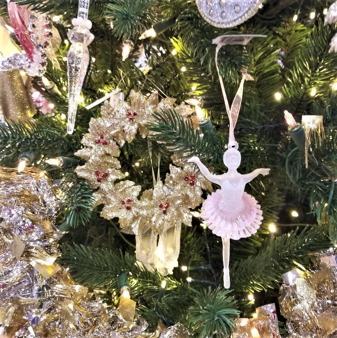 Gold glitter ornament shaped like a wreath with red berry accents.