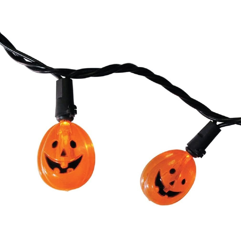 LED lights shaped like smiling jack-o-lanterns on a black wire.