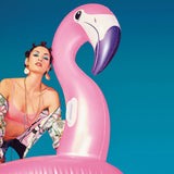 Ride on pool inflatable shaped like a pink flamingo.