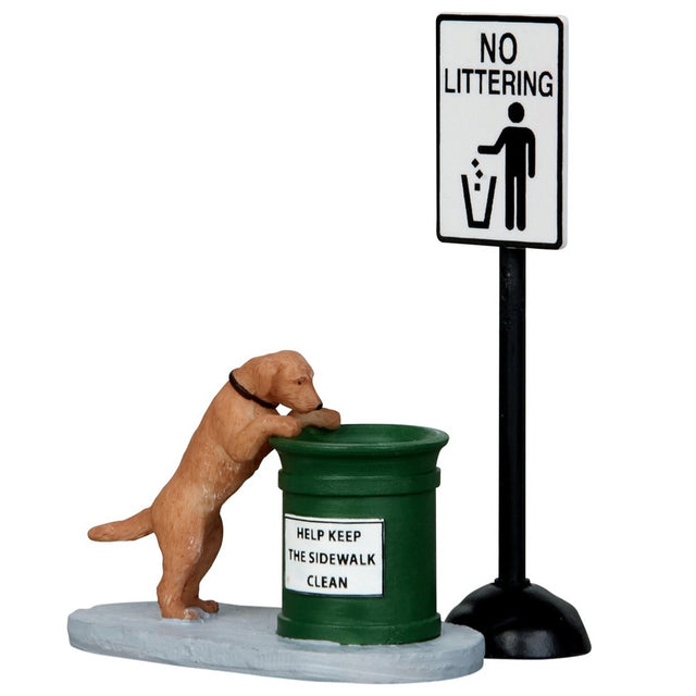 Polyresin figures for a Lemax display. Designed to look like a dog staring into a garbage can. The garbage can reads "Help Keep This Sidewalk Clean." The garbage can is green. Next to the garbage can is a sign on a pole that reads "No Littering."