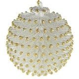 Glitter ornaments shaped like round pine cones. One is silver with gold tips and the other is gold with silver tips.