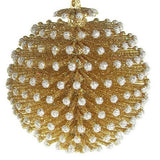 Glitter ornaments shaped like round pine cones. One is silver with gold tips and the other is gold with silver tips.