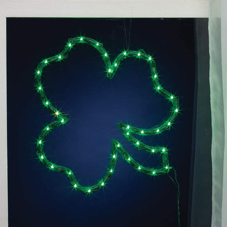 Lighted silhouette shaped like a green shamrock.