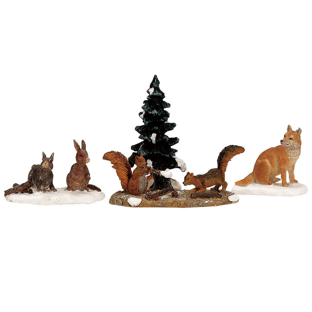 Polyresin figurines for a Lemax display. Designed to look like two rabbits, two squirrels and a fox. Behind the two squirrels is a snow covered tree. The ground is dirt with snow on it.