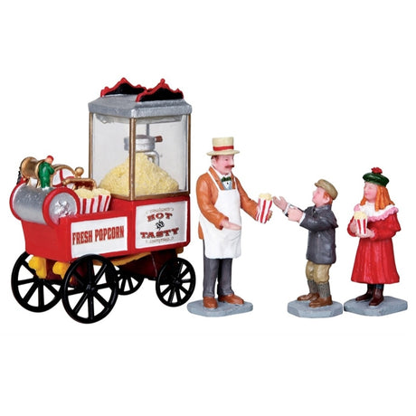 Polyresin figurines for a Lemax Village tabletop display. Designed to look like a popcorn vender giving popcorn to two kids
