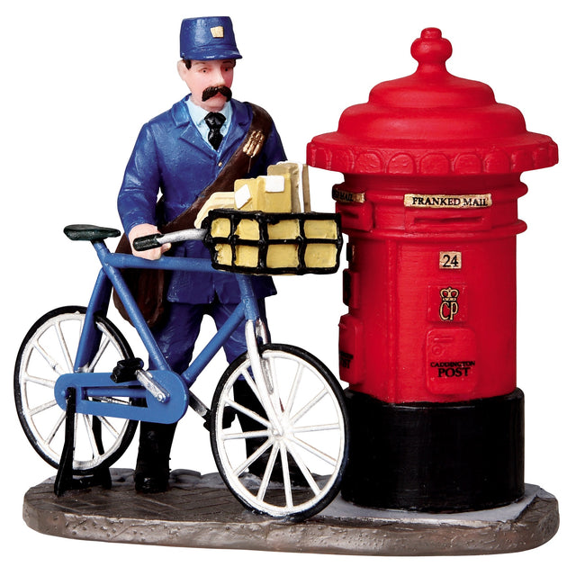 Polyresin figurine for a Lemax Village tabletop display. Designed to look like a postman on a bike next to a red mailbox