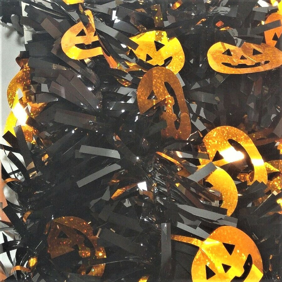 Black tinsel garland with holographic, orange pumpkins.