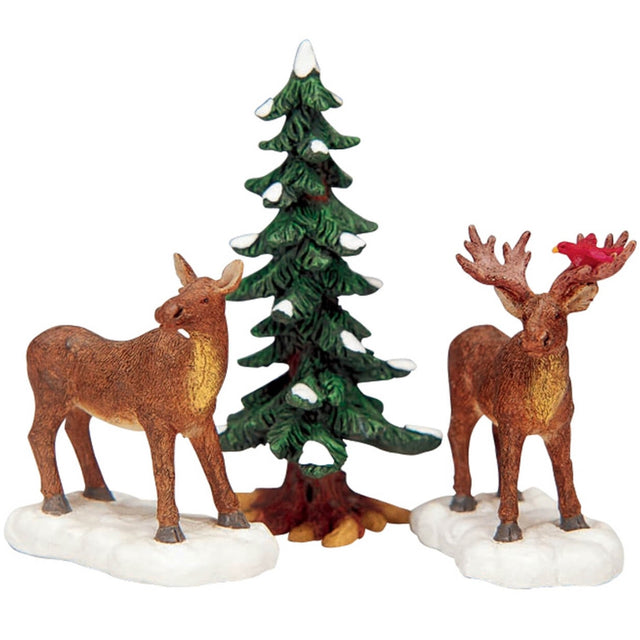Polyresin figurines for a Lemax display. Designed to look like two moose standing in the snow next to a tree. There's a cardinal on the antlers of one of the moose.
