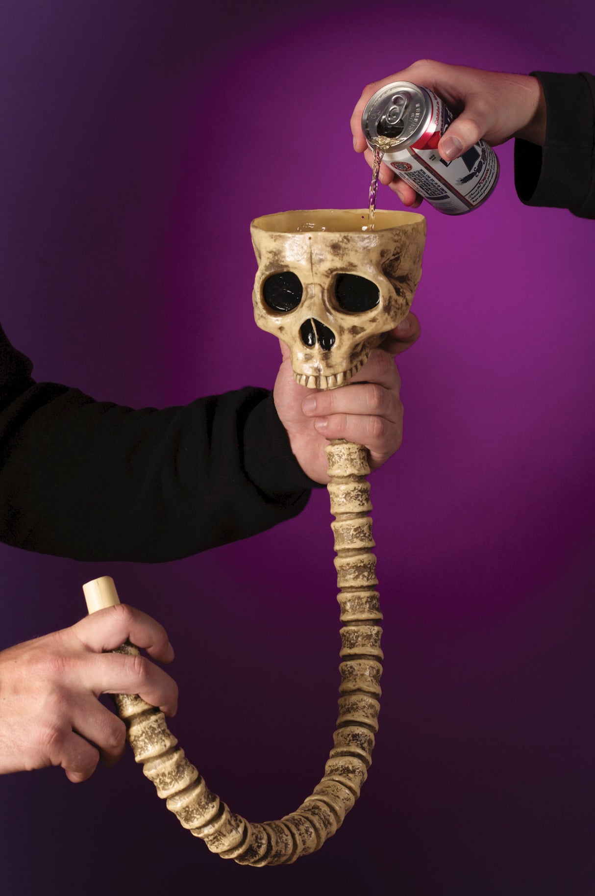 Drink funnel shaped like an open skull with a spine as the hose.