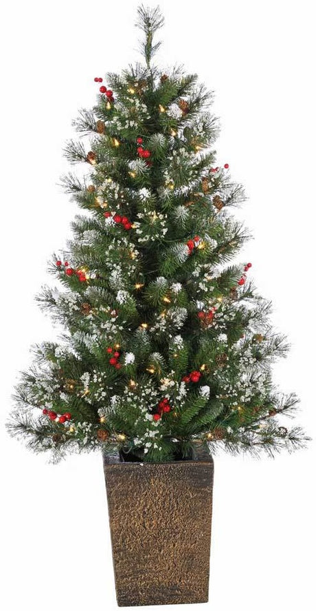 Potted artificial tree. The tree tips are white to look like snow. The lights are warm white and there are red berry accents.