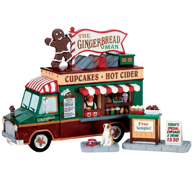 Village accent for a Lemax display. Designed to look like a food vendor truck that serves cupcakes, hot cider and gingerbread. There's a dog waiting patiently for a free sample.