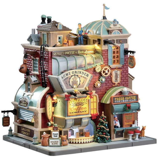 Lemax village building designed to look like a vintage coffee shop. Customers appreciate the sculpture's beauty, quality, and movement. They find the details on the building great, and they love the colors and moving parts. There are different stands places in the building. The loading dock, the Vintage Grind Coffee Company and a place to get coffee in a bag or can.