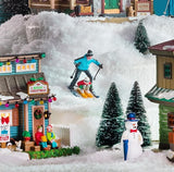 Village figurine for a Lemax display. Designed to look like a dad and son skiing down a hill together.