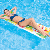 Pool mattress with colorful leaves.