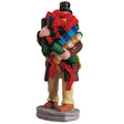 Polyresin figurine for a Lemax display. Designed to look like a person holding too many accessories for wrapping presents.
