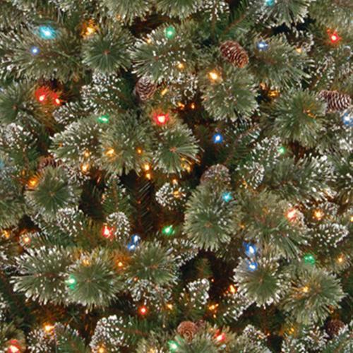 Artificial tree pre-lit with dual lights. Lights change from warm white to multi-colored. Branches are covered in white glitter.