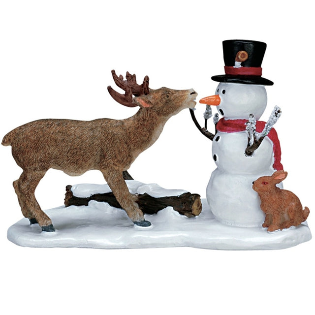 Village accent for a Lemax display. Designed to look like a reindeer trying to eat the carrot that is being used for Frosty the Snowman's nose. 