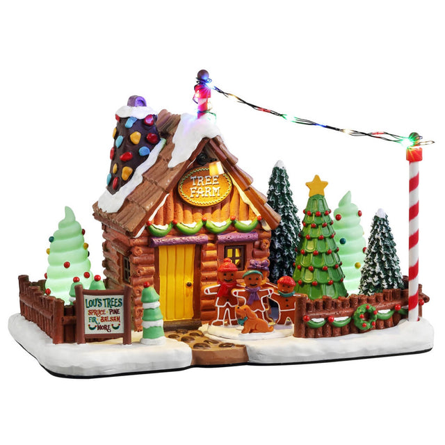 Resin lighted building for a Lemax display. Designed to look like a tree farm where you can choose your favorite tree. Everything appears to be made of candy, gingerbread and frosting.