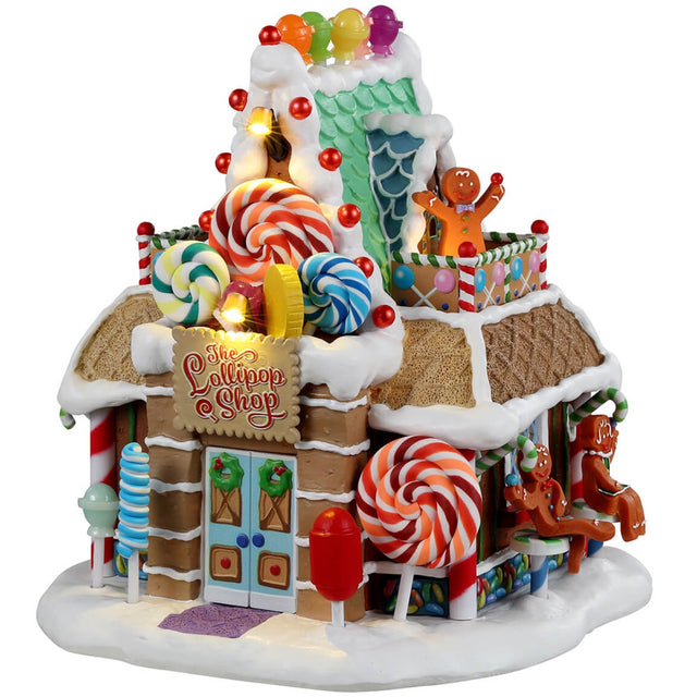 Resin lighted building for a Lemax display. Designed to look like a candy shop made out of gingerbread, candy, frosting and lollipops.