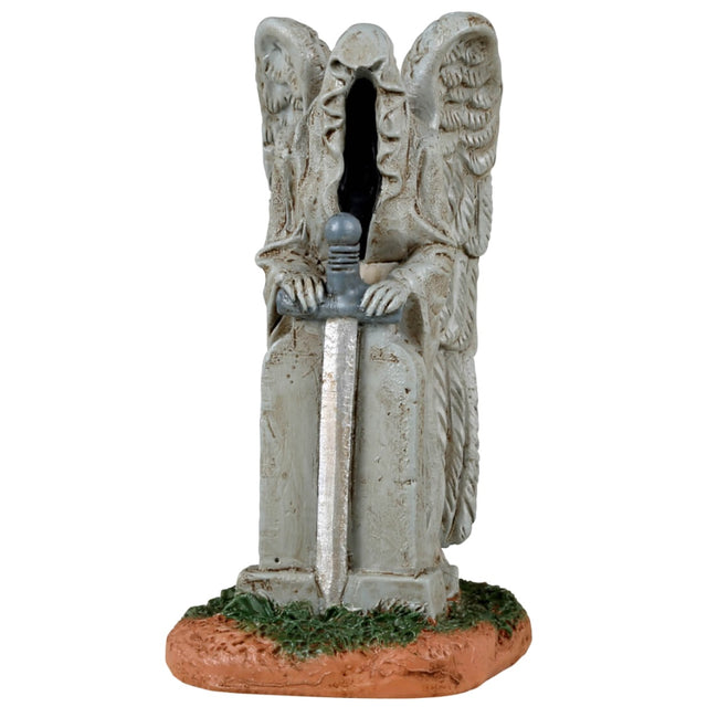 Resin village accessory for a Lemax display. Designed to look like a cemetery statue. It looks like a combination of the Grim Reaper and an angel. There's a sword in his hands.