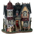 Resin lighted building for a Lemax display. Designed to look like a run down, Victorian-era style mansion. There are ghost shadows in every window and crows all over.