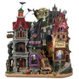 Resin building facade for a Spooky Town Lemax display. Designed to look like a bunch of store fronts. One section is a mortuary with a "help wanted" sign hanging from it. The building next to it reads "NOTION'S POTIONS" and has a witch hat for a roof. The building next to it is a flower shop. Behind them all is a cemetery and a spooky cathedral. There's a witch flying near the moon with bats following behind.