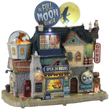 Resin lighted building for a Spooky Town Lemax display. Designed to look like a very large diner. There's a giant, circular sign on the roof that reads "THE FULL MOON DINER" and next to it is a round, yellow moon with a silhouette of a werewolf on it. There's a see through globe with a wolf inside and a werewolf eating inside the diner. There's garbage and bones on the sidewalk.