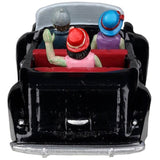 Resin village accent for a Lemax Spooky Town display. Designed to look like three people in a shiny, black convertible car. They're all dressed up. The driver is wearing a suit and a gray hat. The woman in the passenger seat is wearing a purple dress and a blue hat. The woman in the backseat is wearing a pink dress, a pearl necklace and a red hat. Their skin is green.