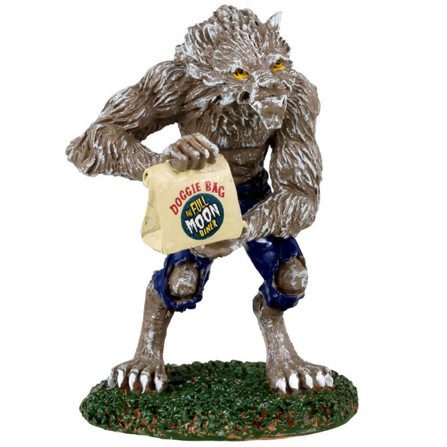 Resin figurine for a Lemax Spooky Town display. Designed to look like a werewolf standing on two legs. He's wearing torn jeans and holding a to-go bag that reads "Doggie Bag The Full Moon Diner."