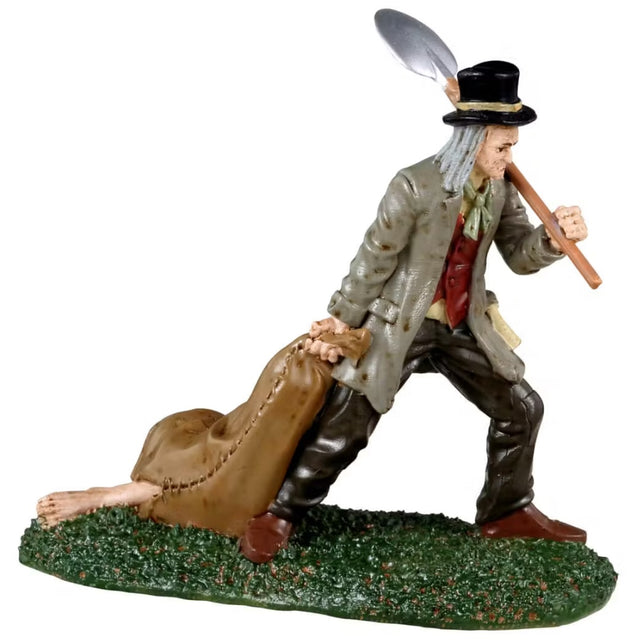 Resin figurine for a Spooky Town Lemax display. Designed to look like a grave digger dragging a brown sack of body parts. He's holding a shovel. He's wearing a top hat, a trench coat, a red vest and a yellow shirt. His pants are black and his shoes are brown.