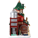 Resin lighted building for a Lemax display. Designed to look like Santa's Reindeer Stables. There are reindeer eating and elves helping Santa Claus get his sleigh ready.