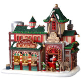 Resin lighted building for a Lemax display. Designed to look like Santa's Reindeer Stables. There are reindeer eating and elves helping Santa Claus get his sleigh ready.