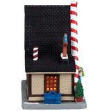Porcelain lighted building for a Lemax display. Designed to look like an A-frame candy shop. There's a large gingerbread cookie statue on the left and a bunch of large cookie and candy cane statues on the right side. There are potted plants and gumball machine accents.