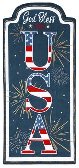 Sign that reads "GOD BLESS THE USA." The background is blue with yellow, white and orange fireworks. The USA is decorated to look like the American flag.