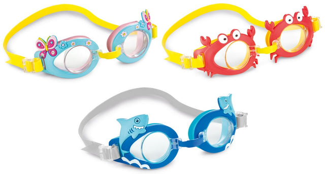 Fun swimming goggles for kids. One features light blue eye cups with pink butterflies and flowers on it with a yellow strap. One features red eye cups that are shaped like crabs with a yellow strap. One features blue eye cups with light blue smiling sharks and a gray strap.
