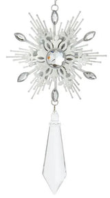 Snowflake shaped ornaments with hanging diamond accents.