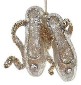 Glitter ornaments shaped like a pair of ballerina shoes.