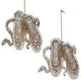 Glitter ornaments shaped like a pair of ballerina shoes.